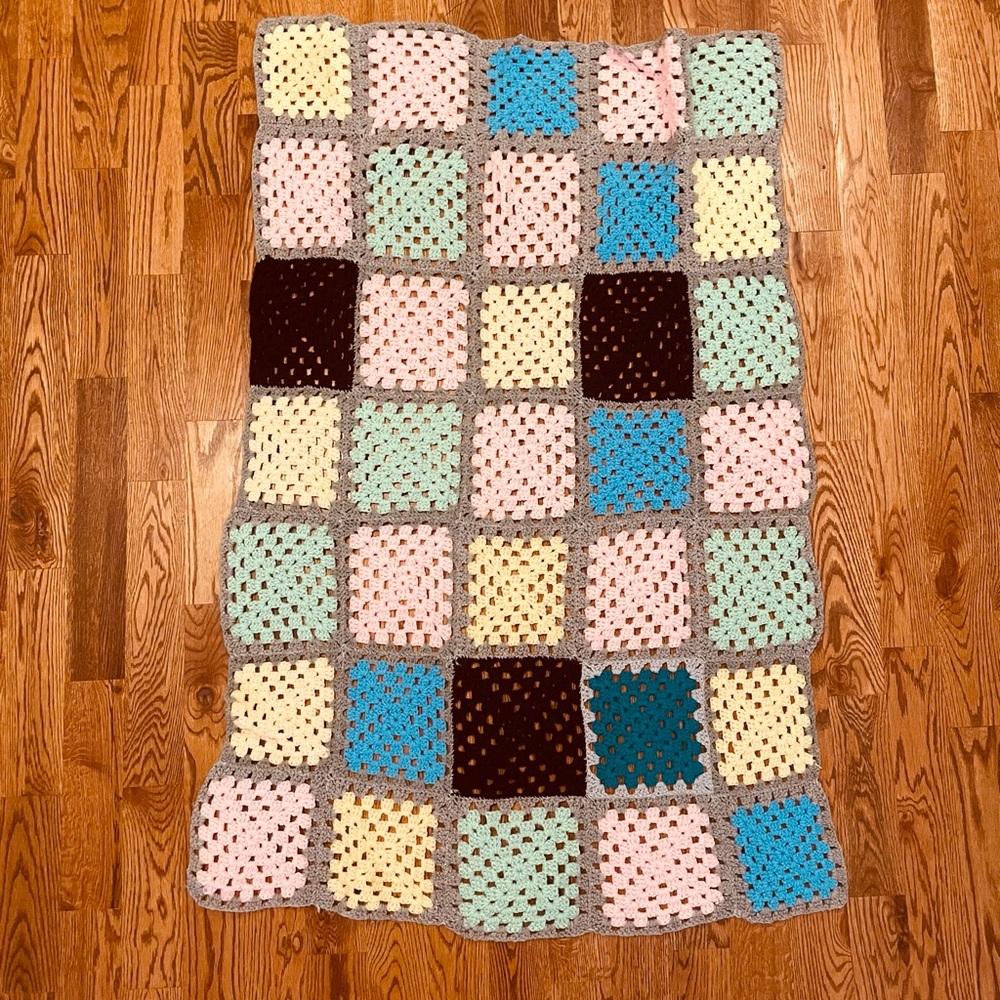 Multicoloured hand crocheted blanket